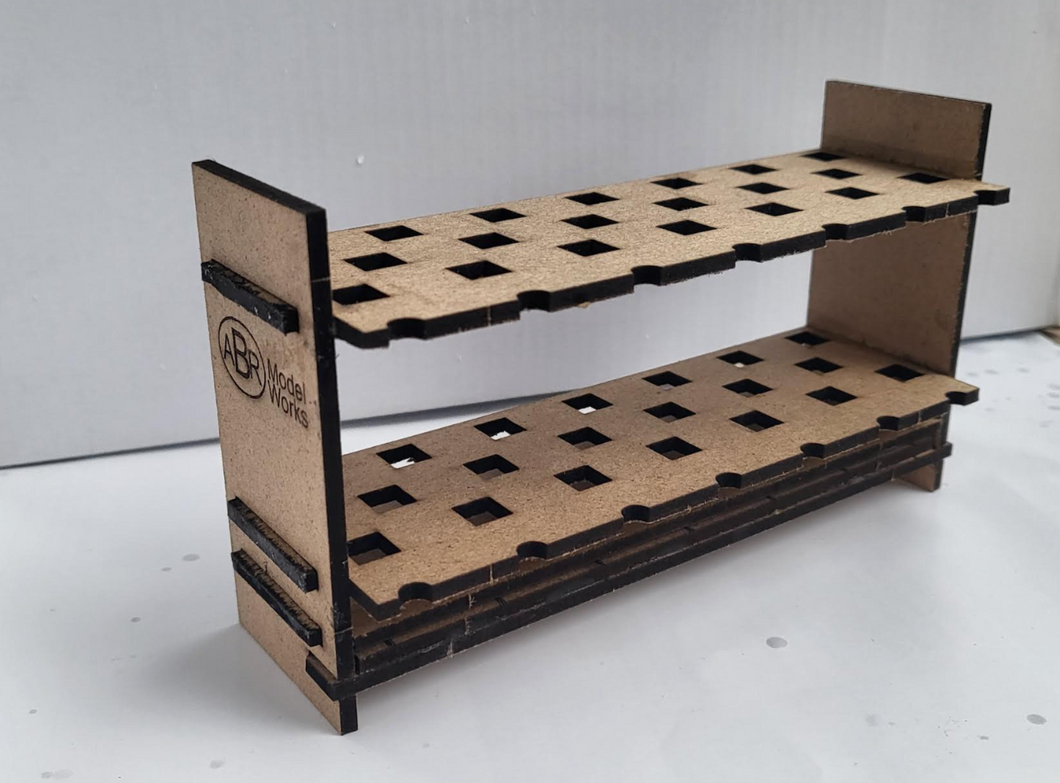 Cardboard display stand with grid pattern on a white surface